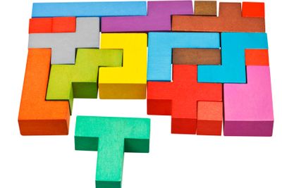 multicoloured puzzle blocks and T-shaped piece
