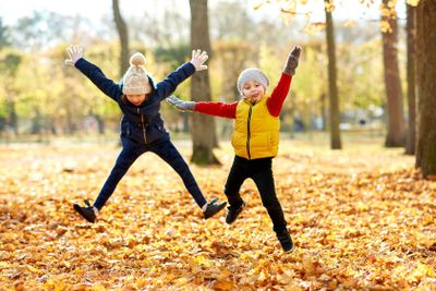 happy children running at autumn park