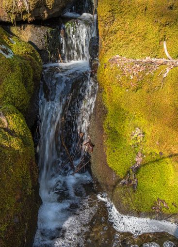 Small waterfall at a creek with rocks