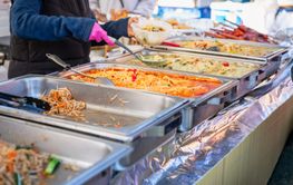 Delicious Asian street food market with takeaway meals,...