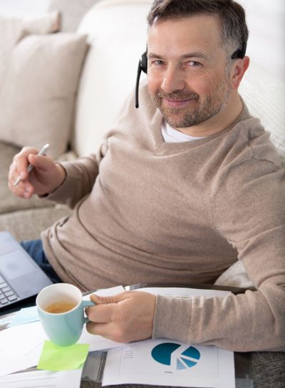 freelancer working from home and using phone