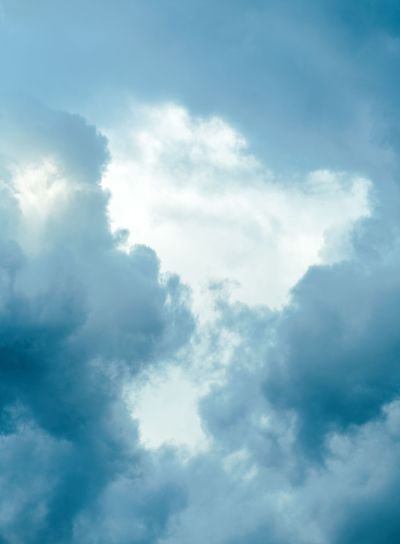 Vertical shot of moody sky with dramatic clouds in...