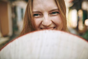 Travel, happy and face of woman in city for holiday,...