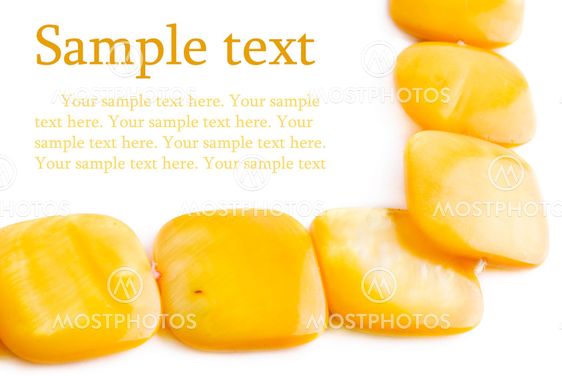 Yellow pearl necklace on white