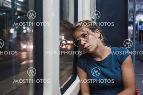Young woman riding a public bus