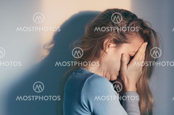 A woman sitting alone and depressed