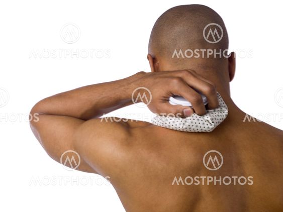 injured man applying ice pack on his neck