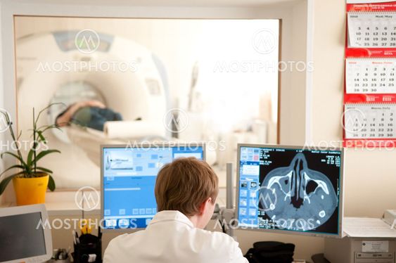 Doctor with CT scan films