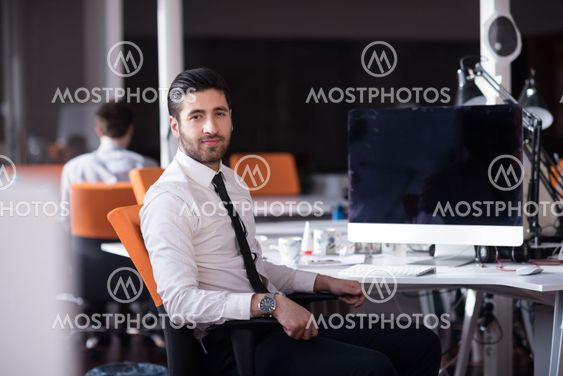 young business man working on desktop computer