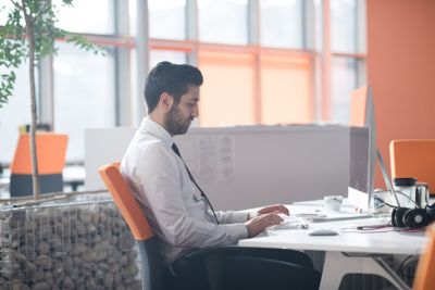 young business man  working on desktop computer