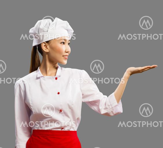 Asian female chef shows his hand