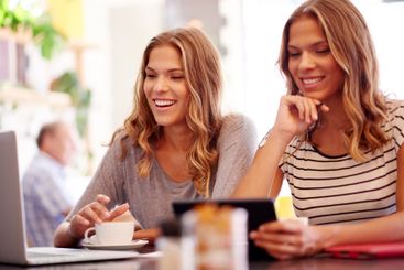 Internet, planning and technology with sisters in coffee...