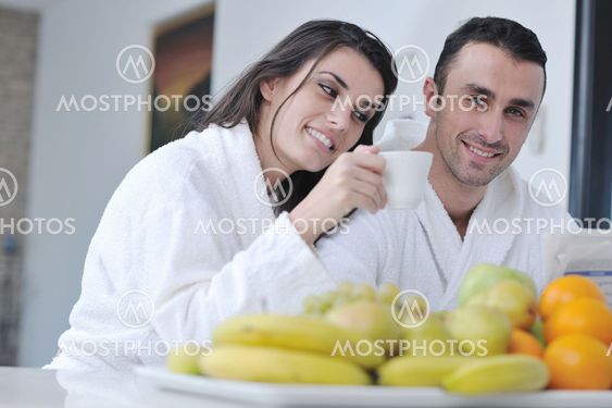 young couple have fun in modern kitchen