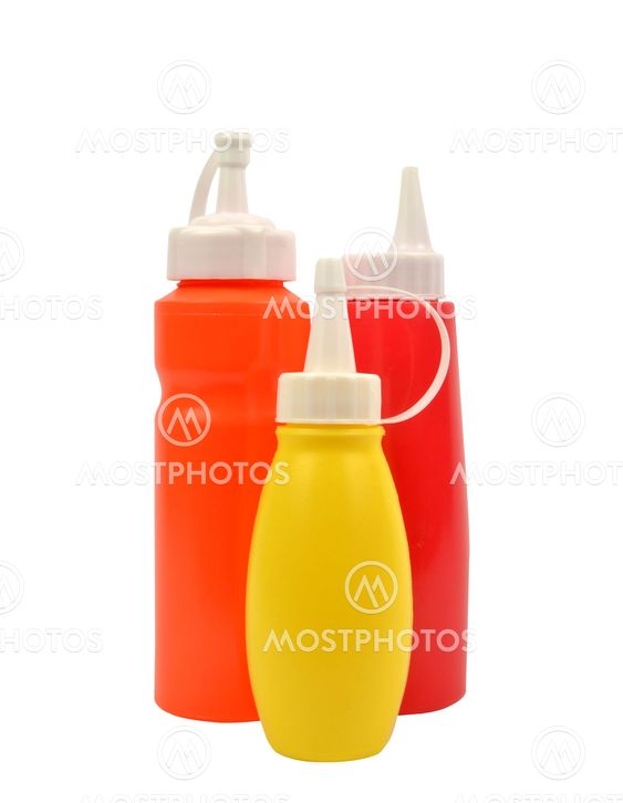mustard and ketchup squirt bottles isolated on white