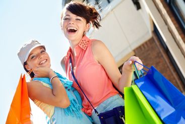 Outdoor, portrait and teenage girls with shopping bags,...