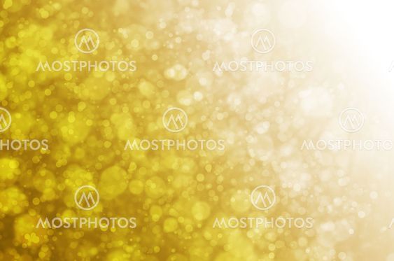 Abstract circles bokeh on yellow background.