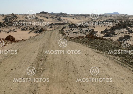 The road running through the Sahara desert.