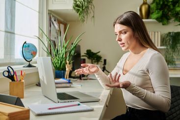 Young woman university student studying using laptop...