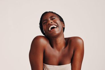 Beauty, skincare and laugh with black woman in studio...