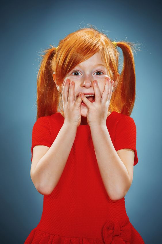 Beautiful portrait of a surprised little girl