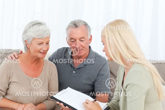 Seniors with doctor at home