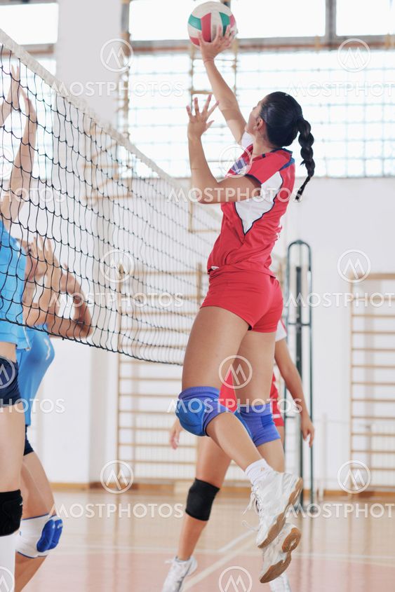 girls playing volleyball indoor game