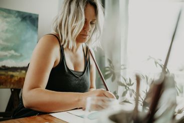 Paint brush, paper and art woman drawing creative...