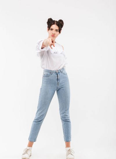 Full length portrait of serious strict girl having double...