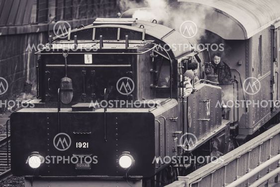 Vintage steam train departing at Stockholm cental station