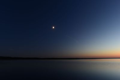 Moon in the dark night sky moonlight with the afterglow...