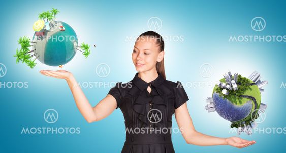 Businesswoman holding two earth globes