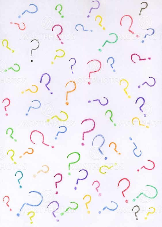 Lots of colorful question marks drawn with crayons on white paper.