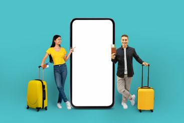 Travelers multiethnic couple with phone mockup, blue...