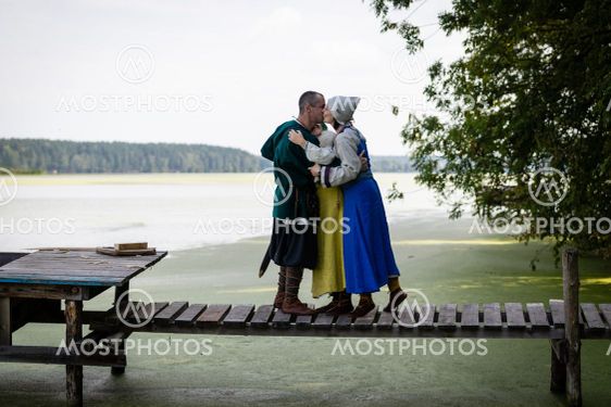 Viking family on the footbridge by the lake