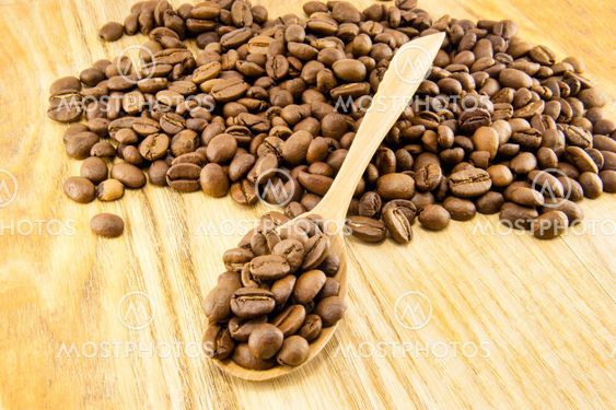 Coffee beans on vintage wooden board