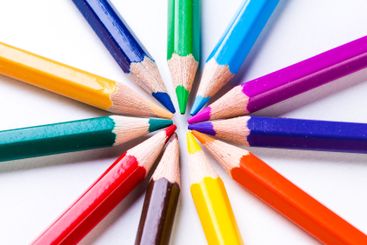 Colorful arrangement of colored pencils creating a...
