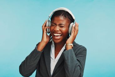 Headphones, happy and business black woman in studio to...