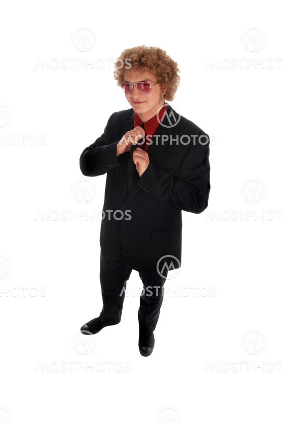 Businessman doing up his tie
