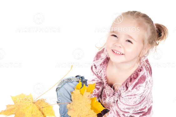 Toddler with maple leaves