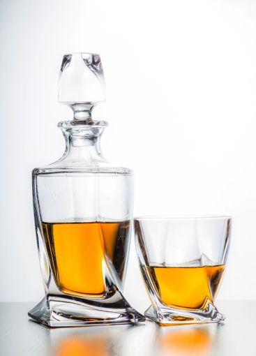 Strong alcoholic drink in glass close up