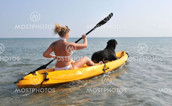 woman and og on a kayak