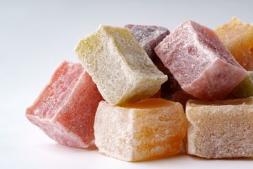 Colorful assortment of traditional sweets arranged on a...