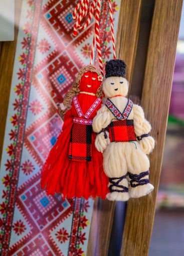Traditional Bulgarian Martenitsa dolls made of red and...