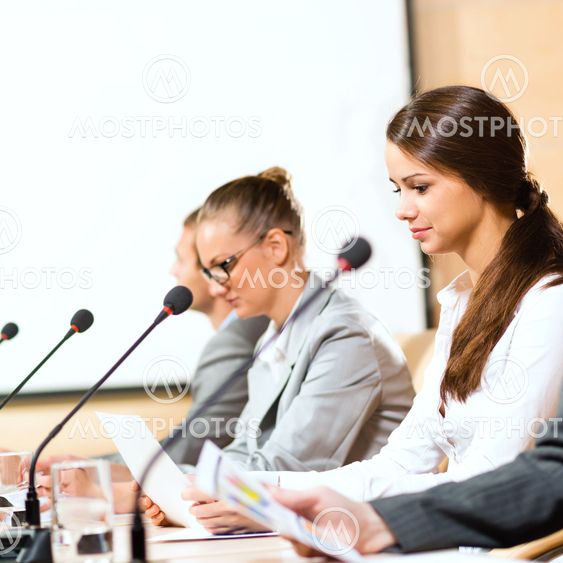 businessmen communicate at the conference