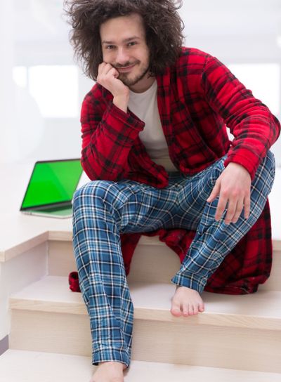 freelancer in bathrobe working from home