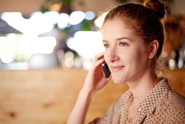 Phone call, smile and woman in cafe with remote work,...