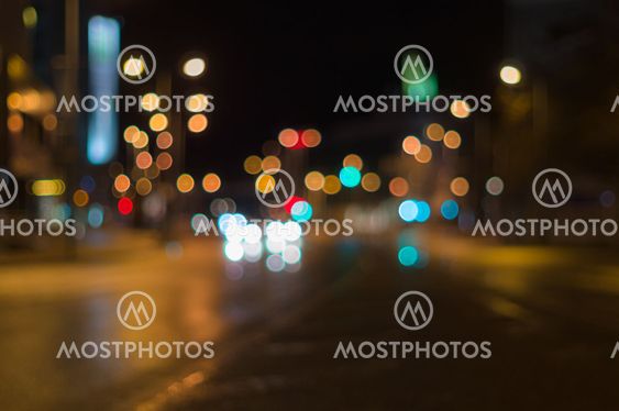 City traffic night blurred background with bokeh lights