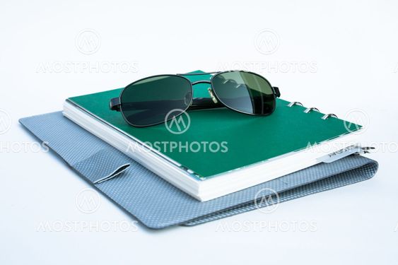 Sunglasses on a spiral notebook