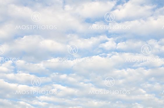 White clouds over blue sky