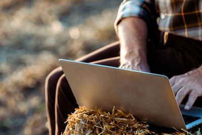 panoramic shot of self-employed man typing on laptop...